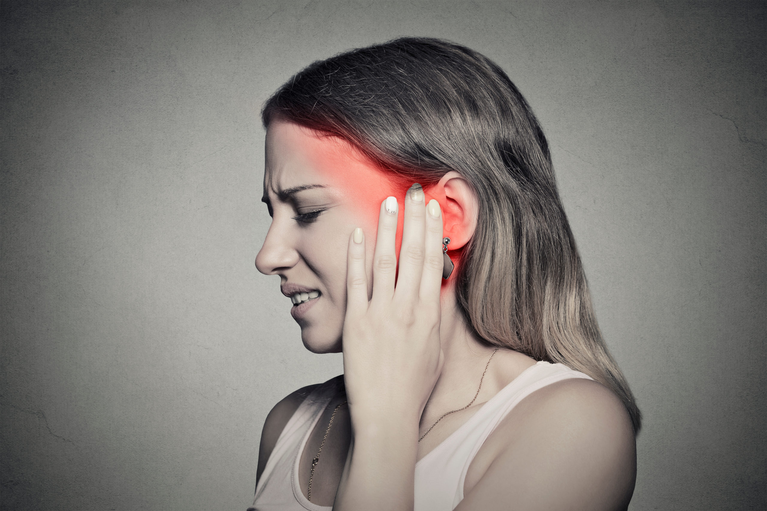 side profile sick female having ear pain touching painful head